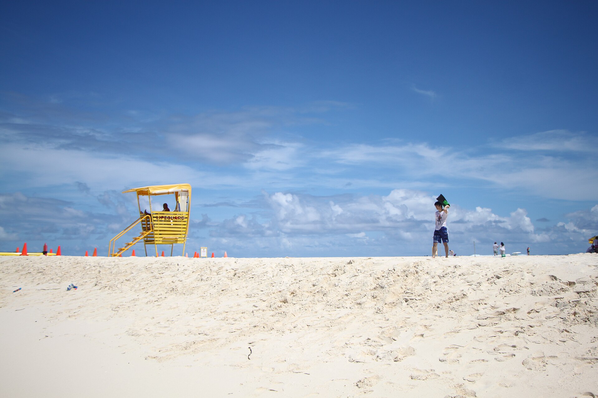 A bright white-sand day on Mañagaha Beach near Saipan
