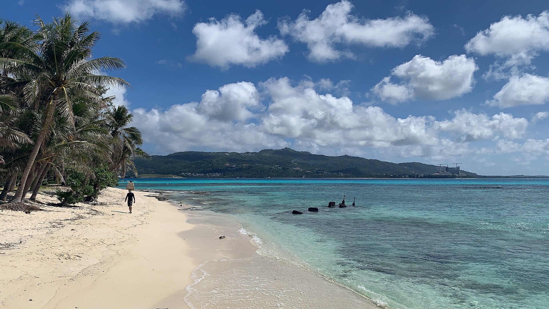 A calm tropical lagoon and shoreline near Mañagaha Island